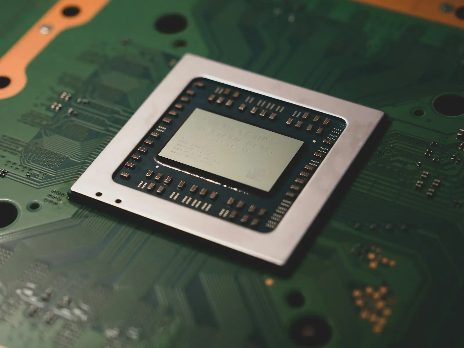 A close-up of a computer processor chip on a circuit board, illustrating the technical depth behind Anthropic's AI chip design move.
