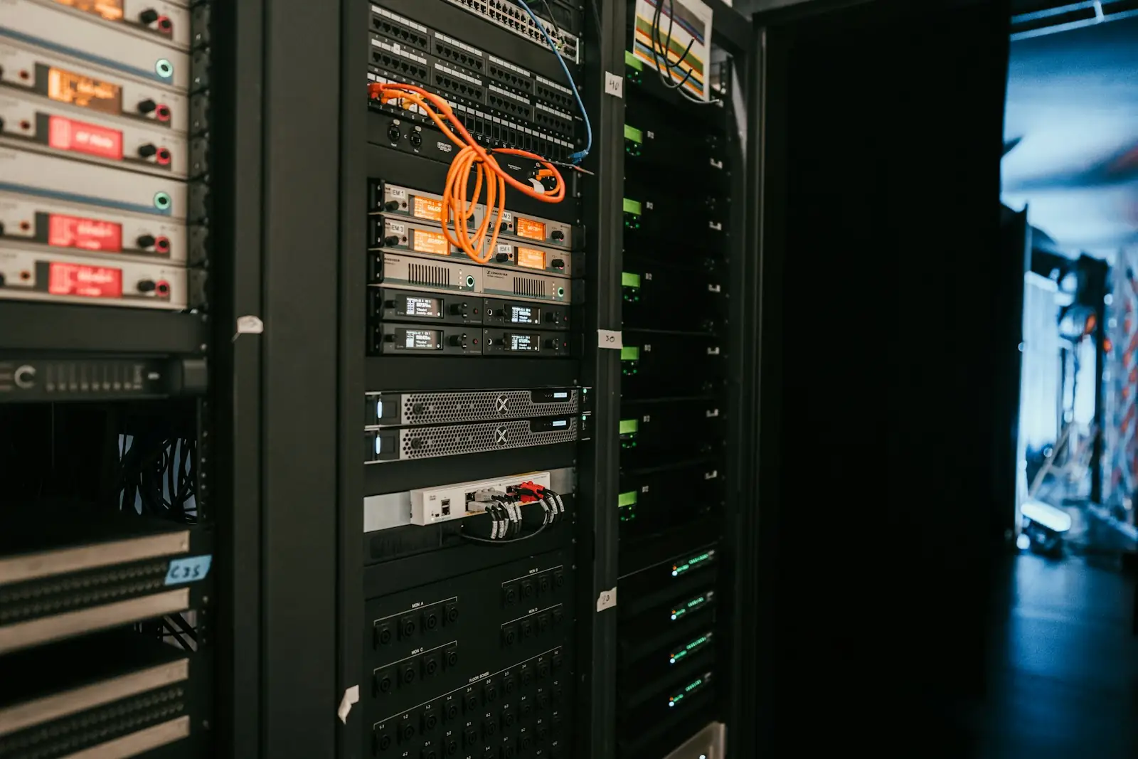 A rack of servers in a data center, representing the AI infrastructure decisions behind Anthropic's new chip design team.