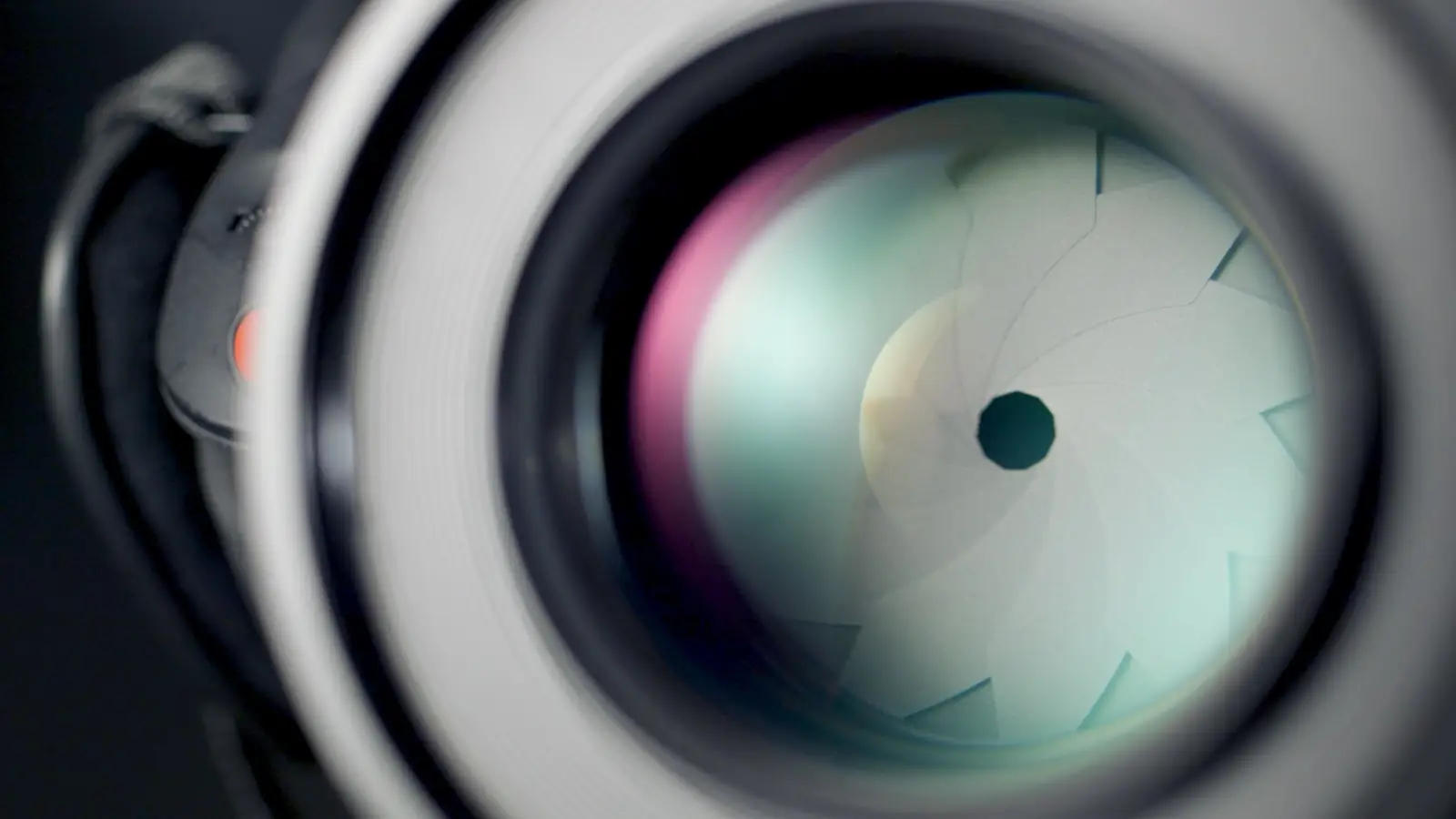 A close-up of a camera lens, representing the production quality bar that entertainment-style branded content sets.