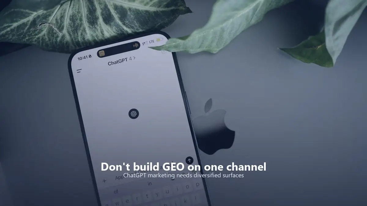 Smartphone showing an AI chat interface beside a laptop, representing mobile ChatGPT marketing and AI visibility.