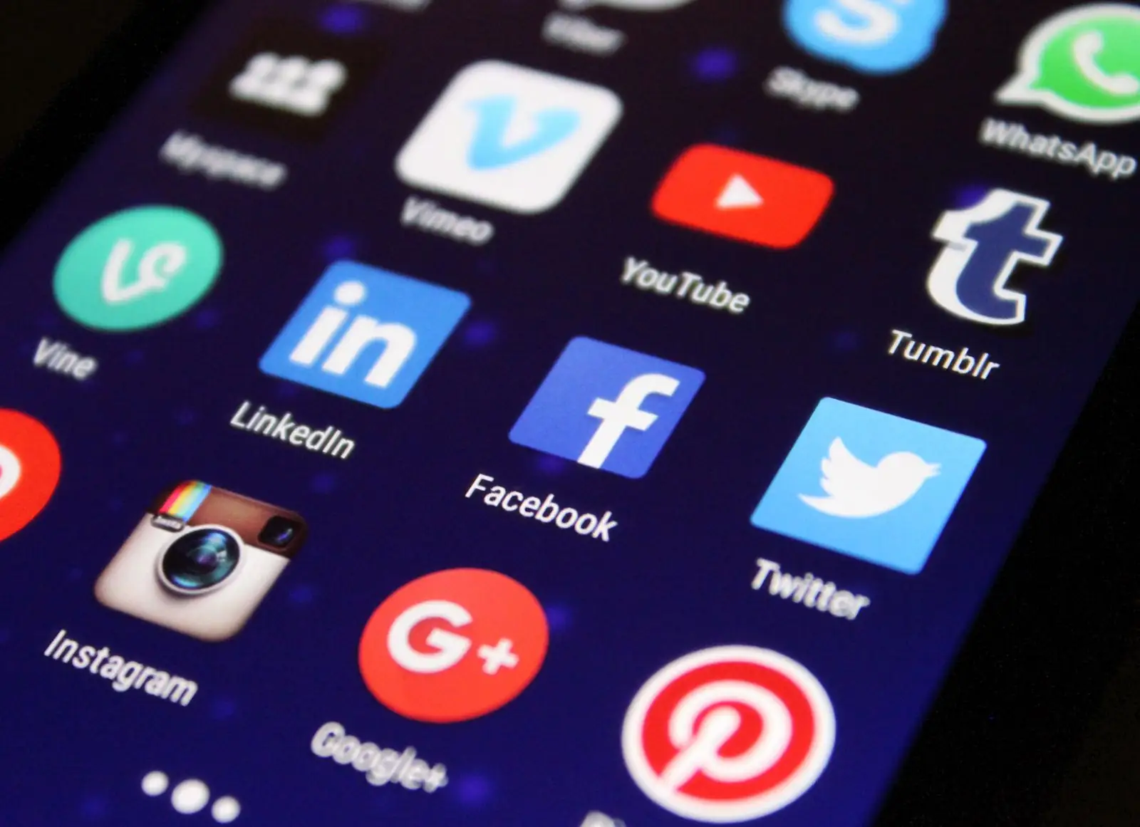 Smartphone and laptop on a desk representing a repeatable social media content system for Instagram growth.