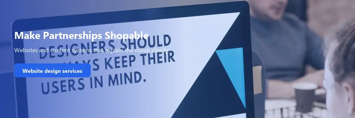 Designer at a computer, used as a promo for partnership-ready website design.
